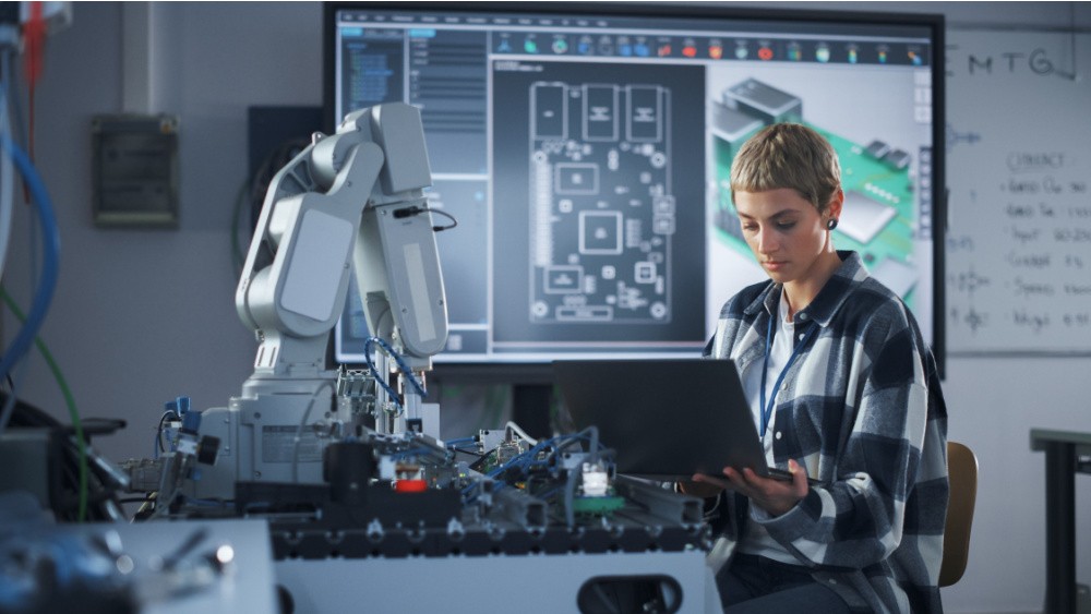 Woman sitting in a lab.