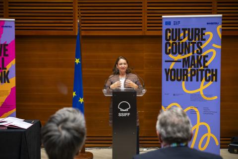 Photo of Ana Vizcaino of the Compana Espanola de Reafianzamiento or abbreviated CERSA, speaking at the signing ceremony during the San Sebastian Film Festival