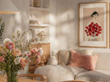 A living room with a couch and a vase of flowers
AI-generated content may be incorrect.