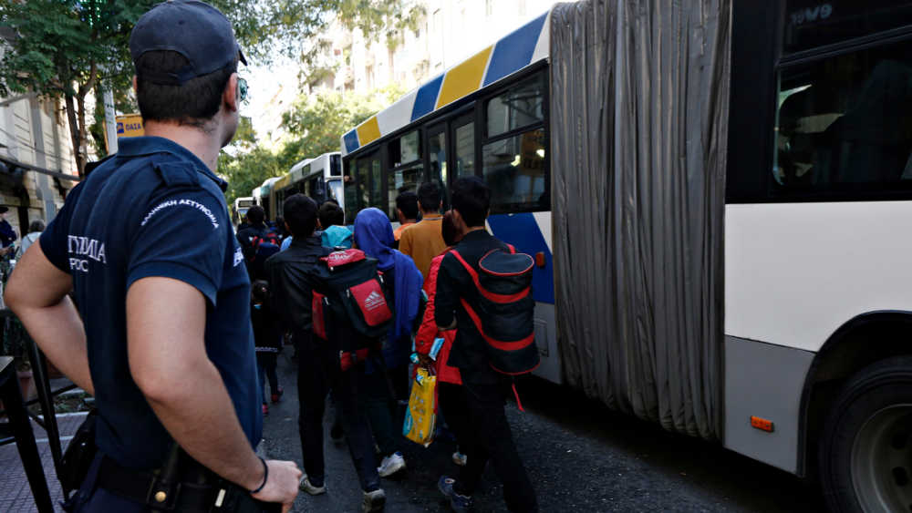 People getting on a bus.