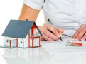 woman signs agreement for house